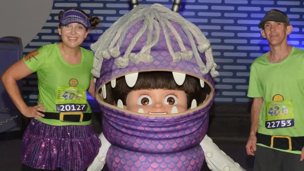 Runners posing with Disney character during the Walt Disney World Marathon