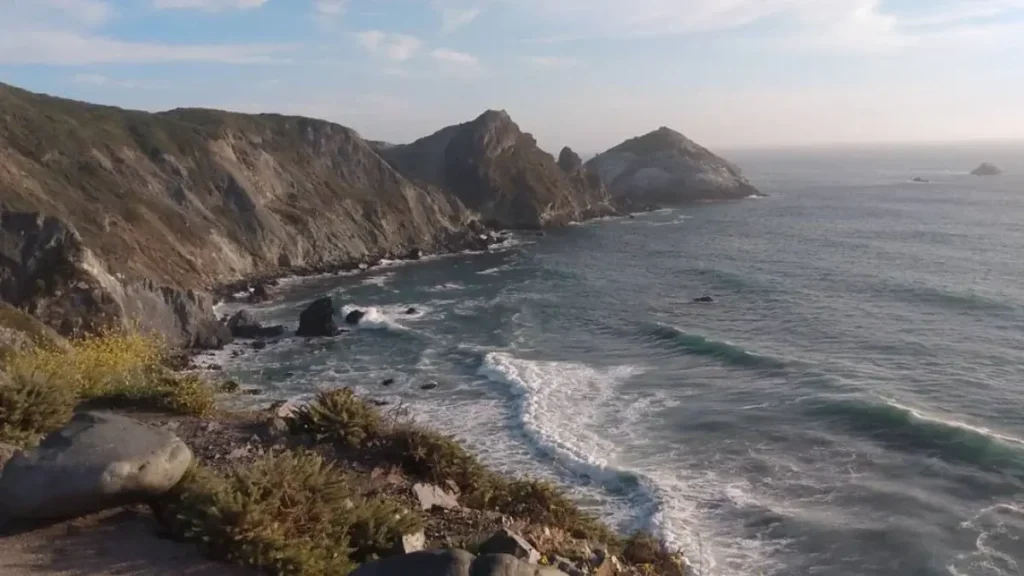 A stunning view of coastal cliffs and the sea along the course at the Big Sur International Marathon