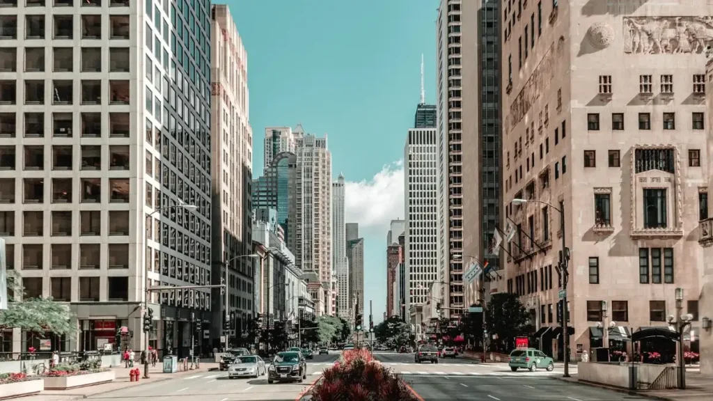 A busy street with buildings and traffic in Chicago, Illinois.