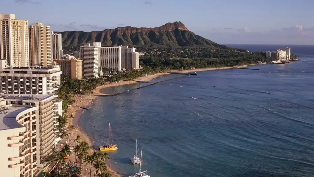 Runners experience the iconic beauty of Waikiki Beach and Diamond Head during the Honolulu Marathon in Hawaii.