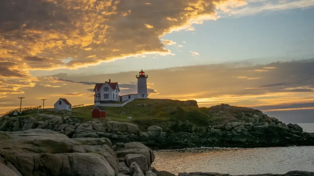 Sunrise paints the sky above a scenic lighthouse near the Bay of Fundy International Marathon in Lubec, Maine.