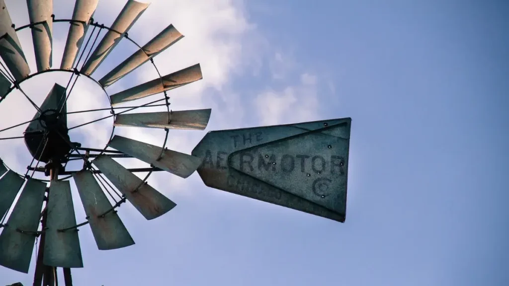 Vintage windmill under a blue Kansas sky, representing the best marathons in Kansas.