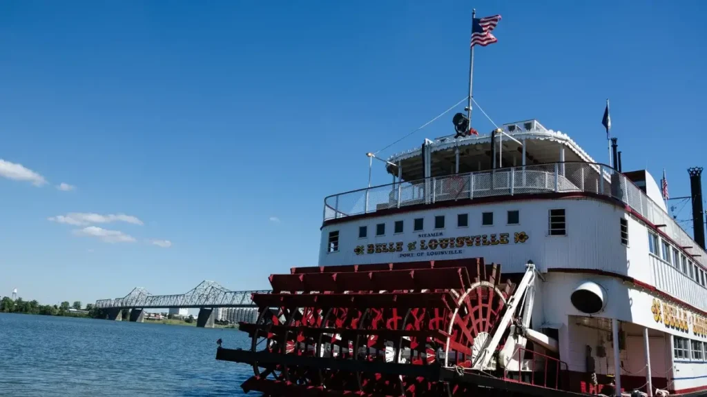 Iconic Belle of Louisville steamboat with a bridge in the background, connecting themes of the best marathons in Kansas.