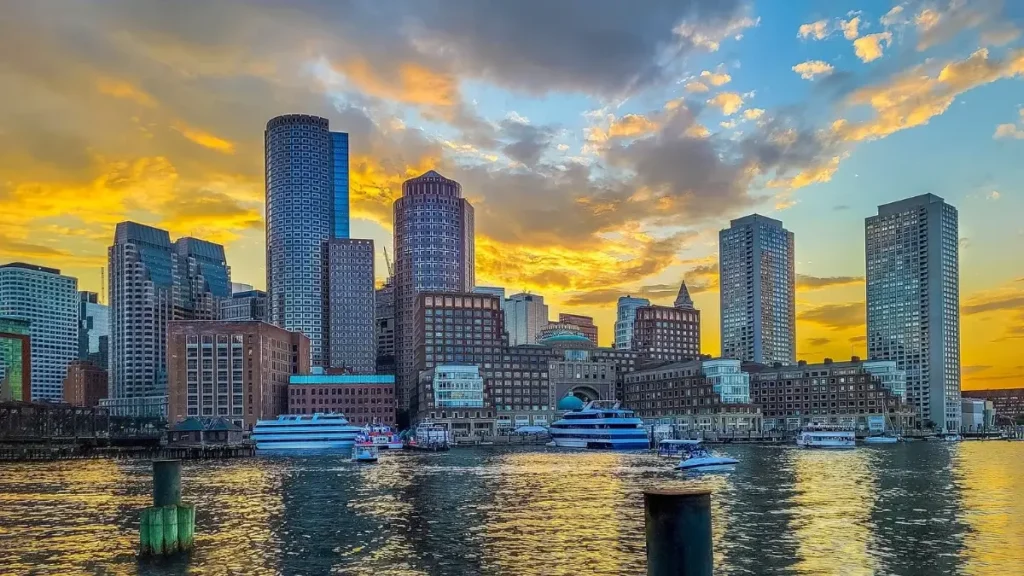 The sun sets on the Boston, Massachusetts, skyline.